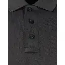 f5842-mens-raglan-sleeve-utility-polo-black-sunglass-loop.webp